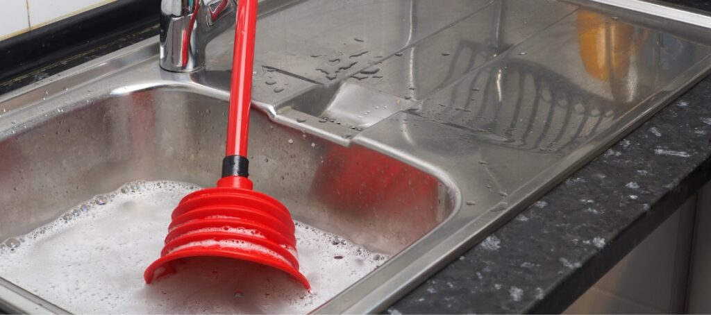 A plunger in a full sink
