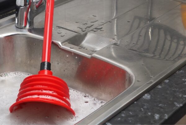 A plunger in a full sink