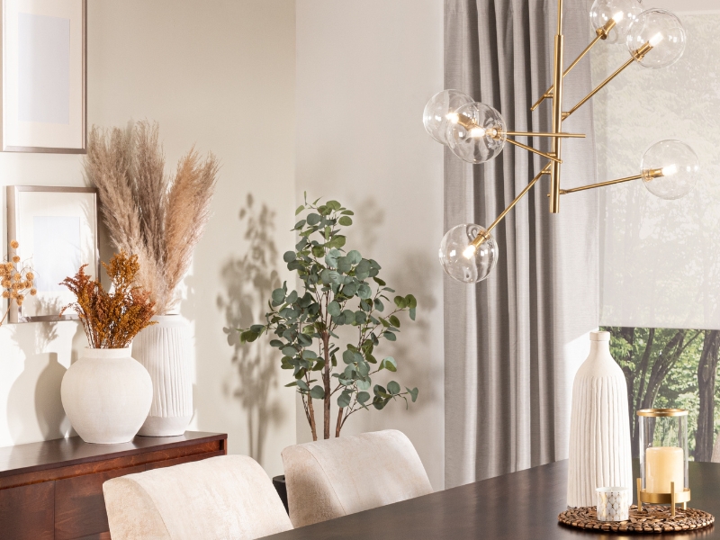 A feature lighting item hanging over a dining table